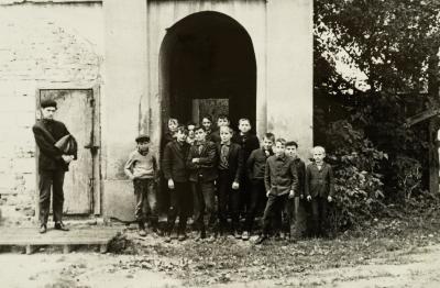 Boys in Front of the Building — unknown
