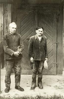 Two Older Men in Front of the Entry Elements — unknown
