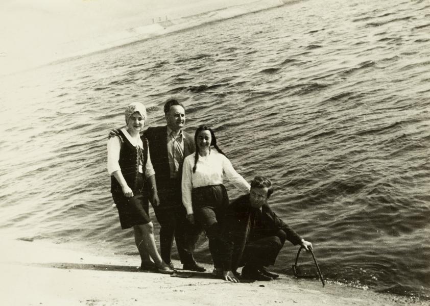 Group of People with Volodymyr Ovsiichuk on the Shore of a Pond