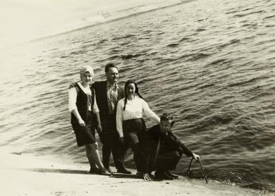 Group of People with Volodymyr Ovsiichuk on the Shore of a Pond — unknown