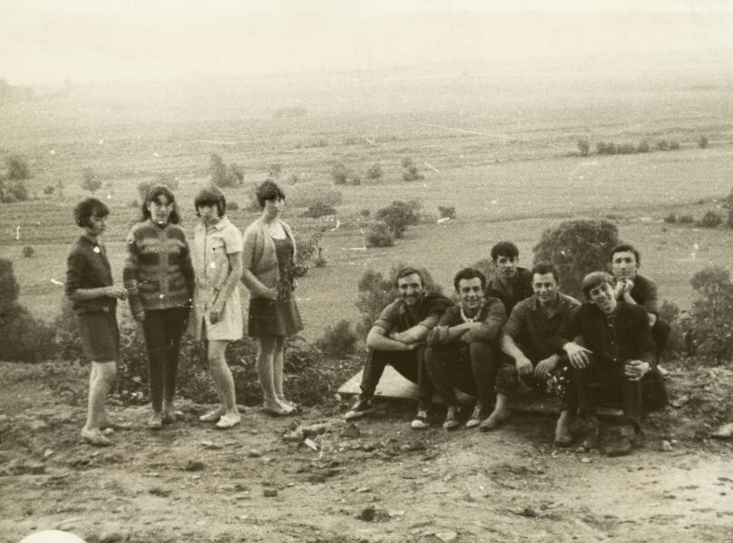 Group of Young People Posing Against the Backdrop of the Landscape
