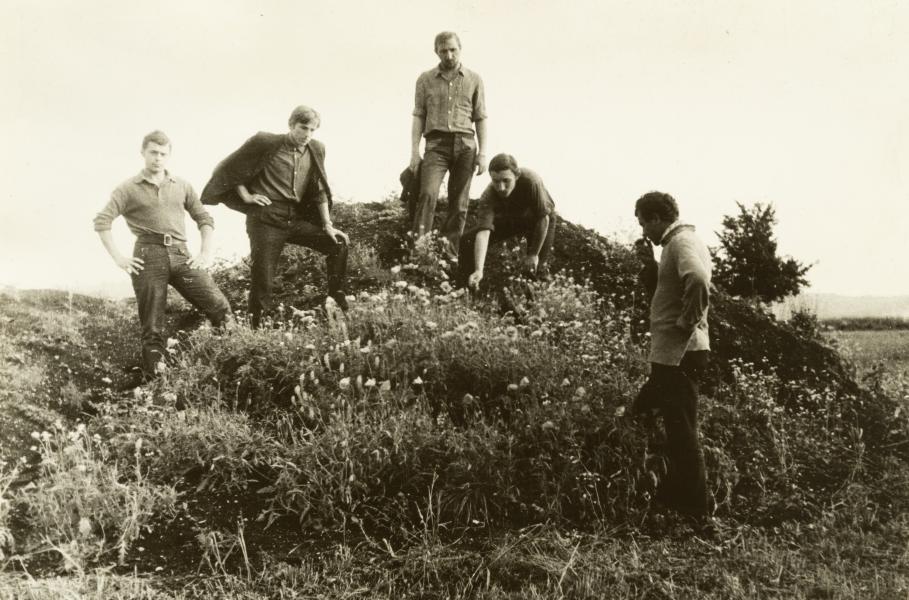 Group of Young People Posing Against the Backdrop of the Landscape