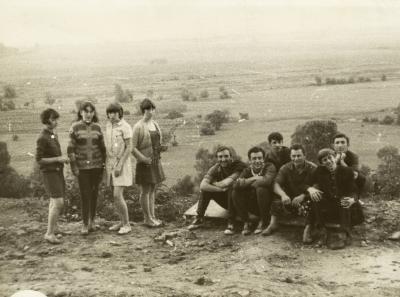 Group of Young People Posing Against the Backdrop of the Landscape — unknown