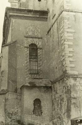 Fragment of a Building with an Ornamented Window Frame and a Buttress — unknown