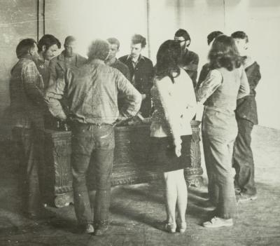 Group of People Near a Museum Object — unknown